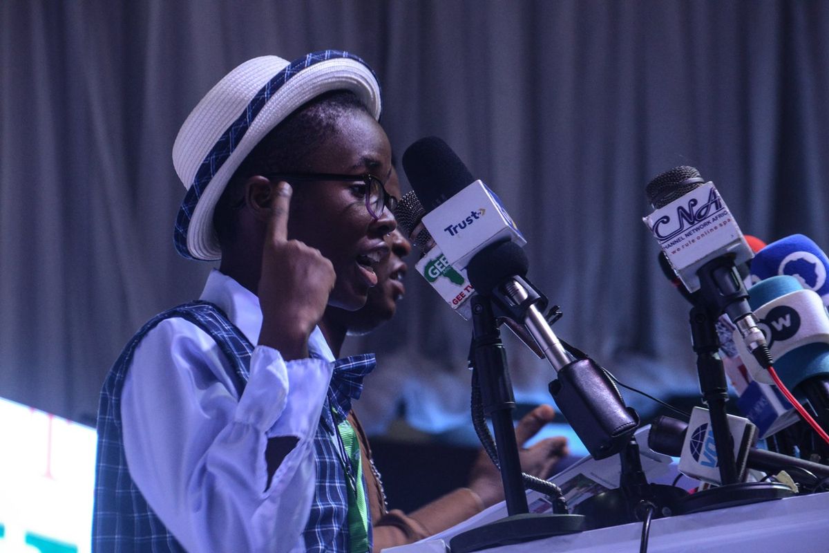 14-year-old Naomi Oloyede delivers a spoken word poem during the signing of the 1st National Peace Accord by political parties ahead of the 2023 general elections in Abuja, on September 29, 2022.