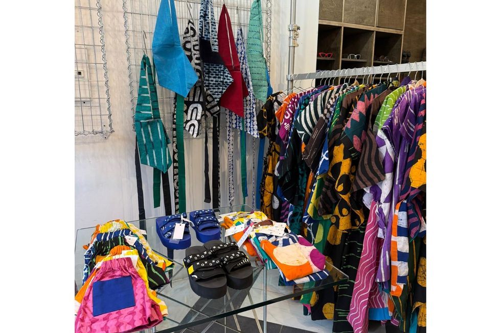 A display of Dye Lab clothing and slides.
