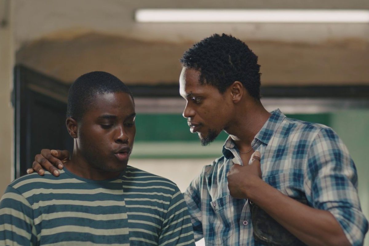A film still of two “nwa boys” in the Nollywood movie “Áfàméfùnà: An Nwa-Boi Story,” standing side by side. 