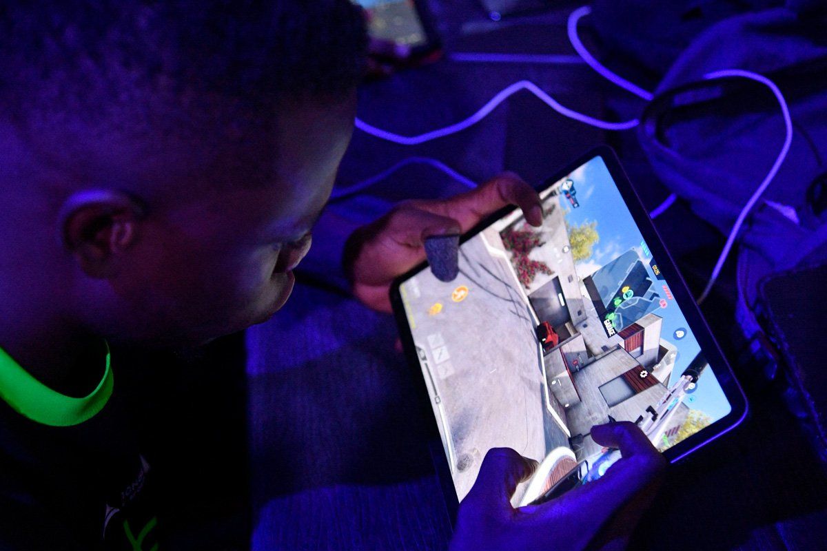 A gamer plays during eSports tournament in Lagos, on June 17, 2023. Nigerian eSports and game enthusiasts were treated to unparalleled gaming experience, networking and all round fun during a two-day eSports tournament organised by GamrX Africa to promote gaming, unify gamers and eSports industry stakeholders across the continent.