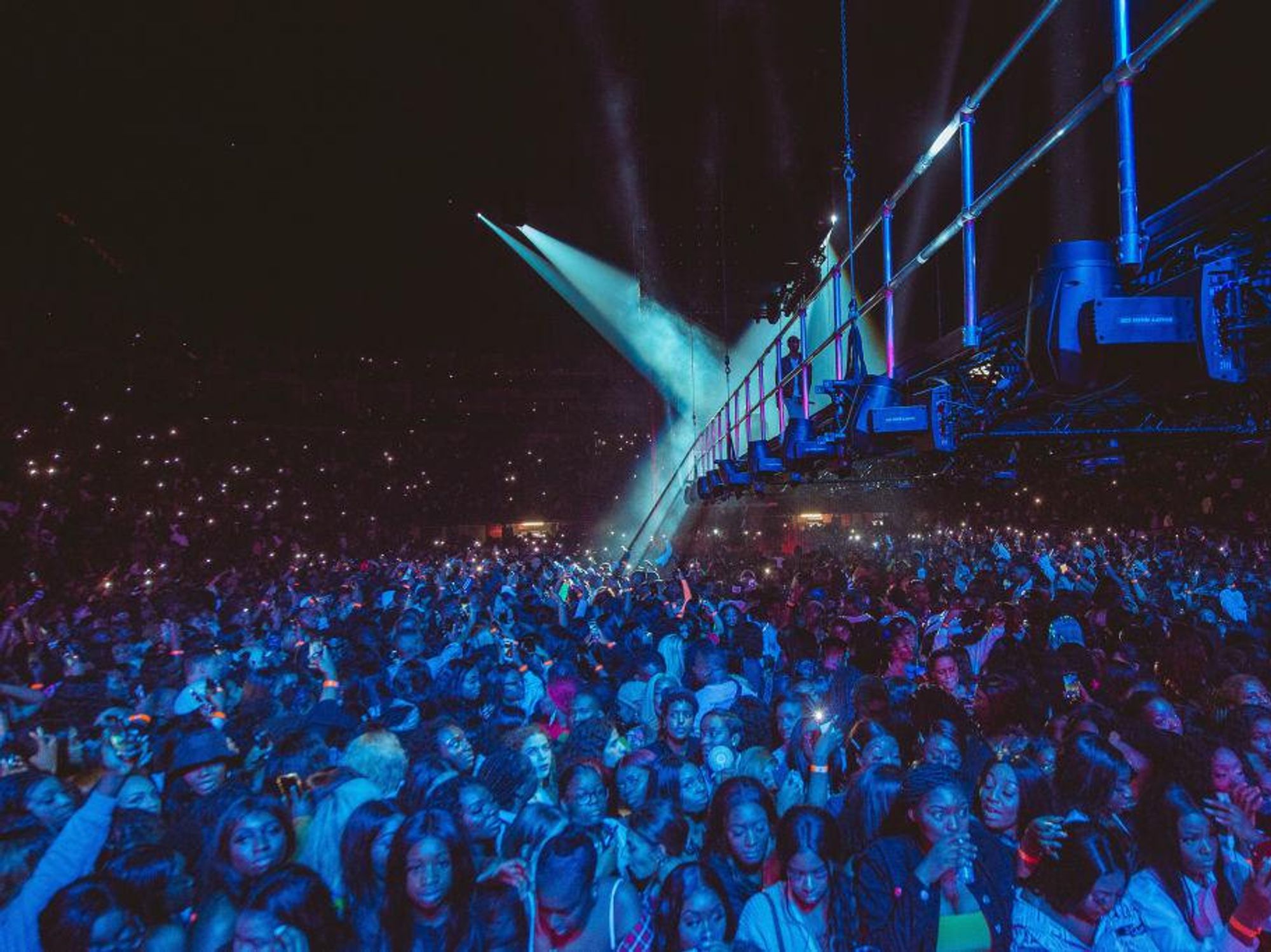A large crowd of audience members for Wizkid's 2019 concert in London's O2 Arena. 