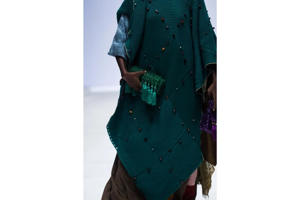 A model holds a tassel bag for the Heru Shezi runway show at Lagos Fashion Week in 2022.