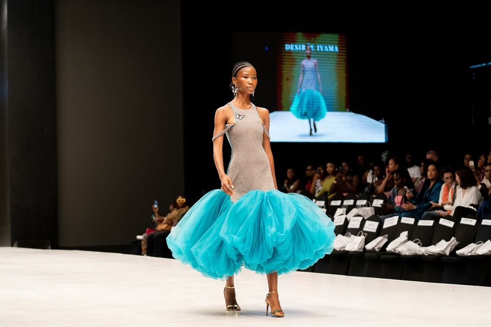 A model walking the Lagos Fashion Week runway in 2023 for Nigerian brand Desiree Iyama.