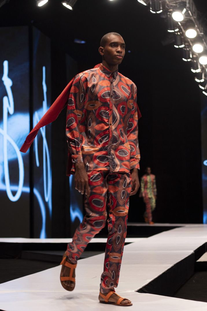 A model walks the runway for class=
