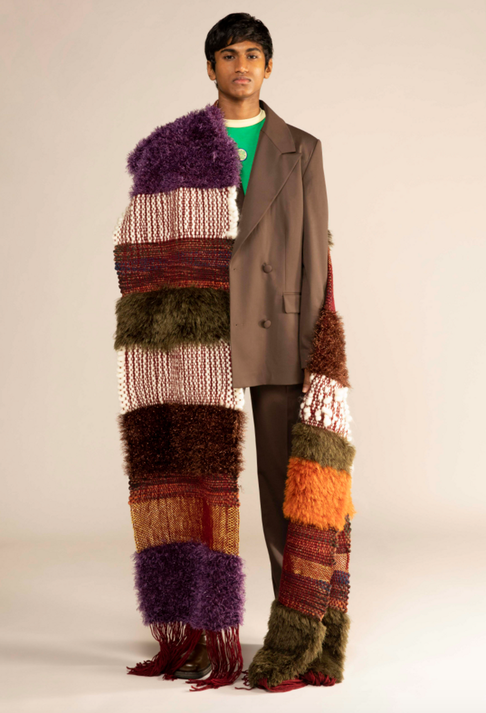 A model wears colorful long scarf designed by Lukhanyo Mdingi