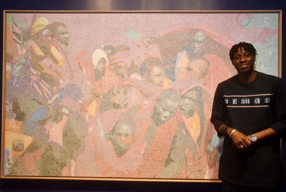 A photo of Alioune Diagne posing with his work during "Seede" Alioune Diagne Preview at Daniel Templon Niemeyer on January 6, 2024 in Paris, France.