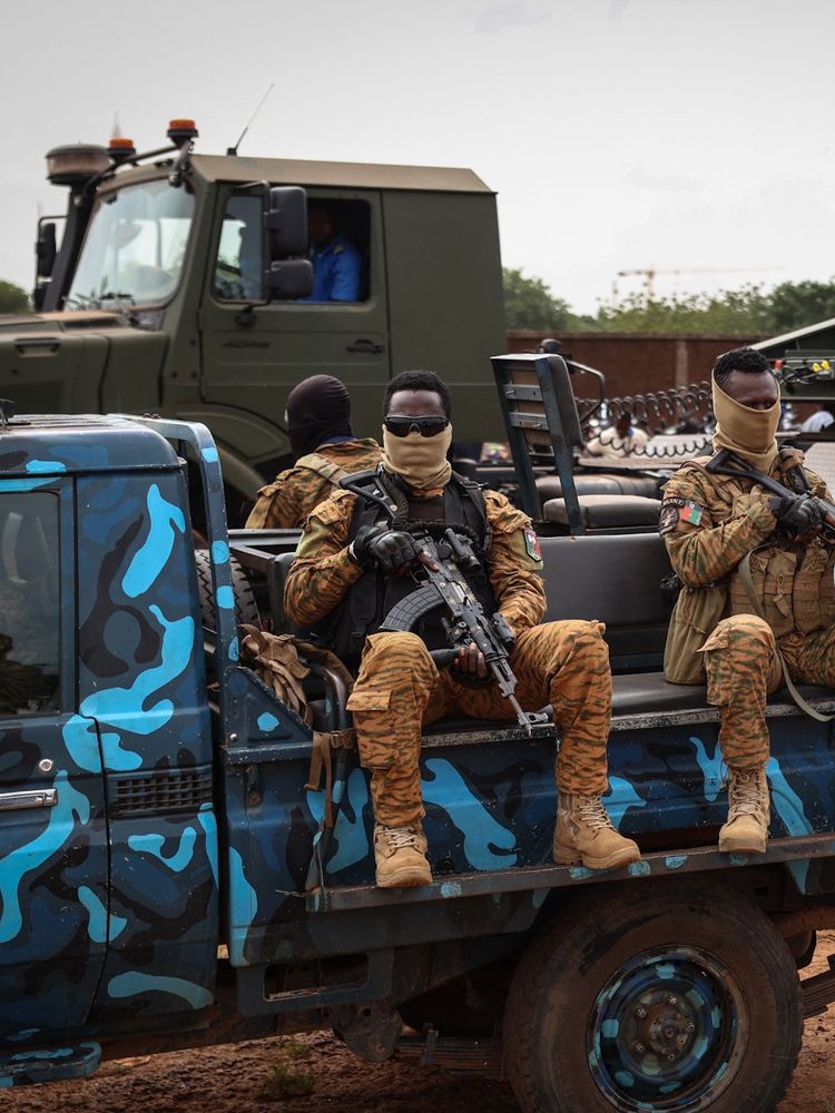 A photo of Burkina Faso's servicemen sitting on a bus.