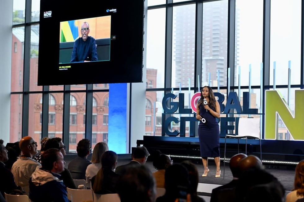 A Photo of Isha Sesay standing on stage as she speaks with President of Rwanda H.E. Paul Kagame remotely during Global Citizen NOW 2024 at Spring Studios on May 02, 2024 in New York City.