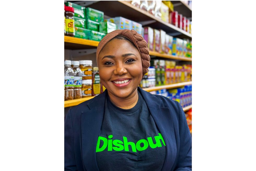A photo of Jamila Zomah, founder and CEO of African Dishout, standing in a supermarket aisle.