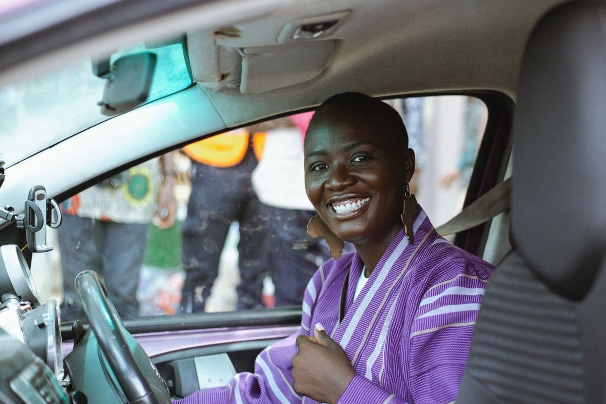 A photo of Pelumi Nubi in her car after her solo drive from London to Lagos on April 7th. 