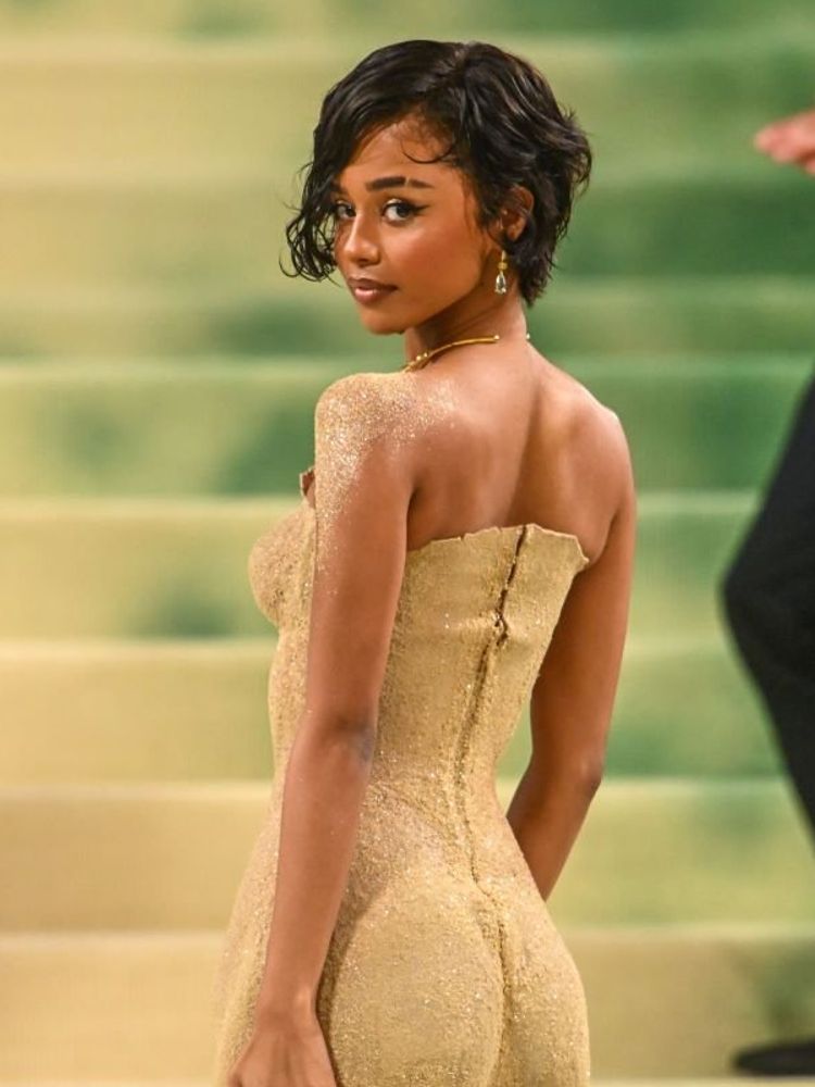 A photo of Tyla wearing a Balmain gown inspired by the captivating “Sands of Time” at the Met Gala 2024.