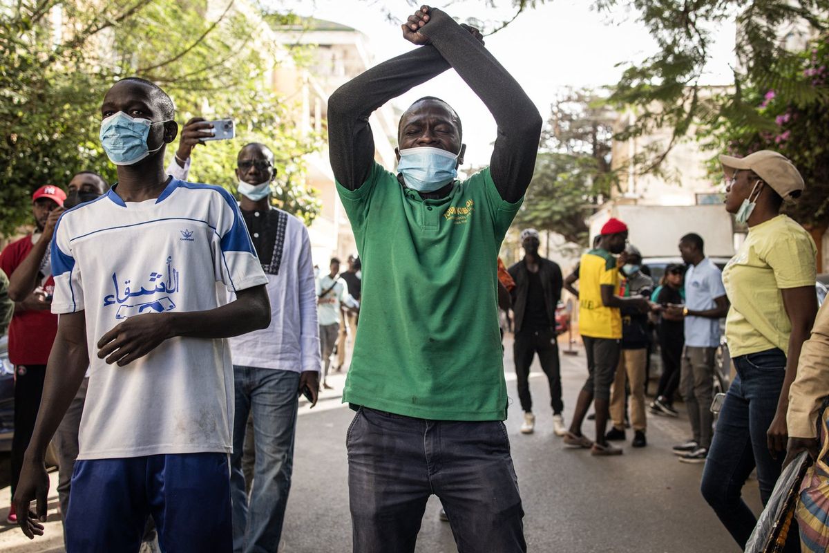 A Protester gestures at the police outside the General Assembly in Plateau, Dakar on February 5, 2024.