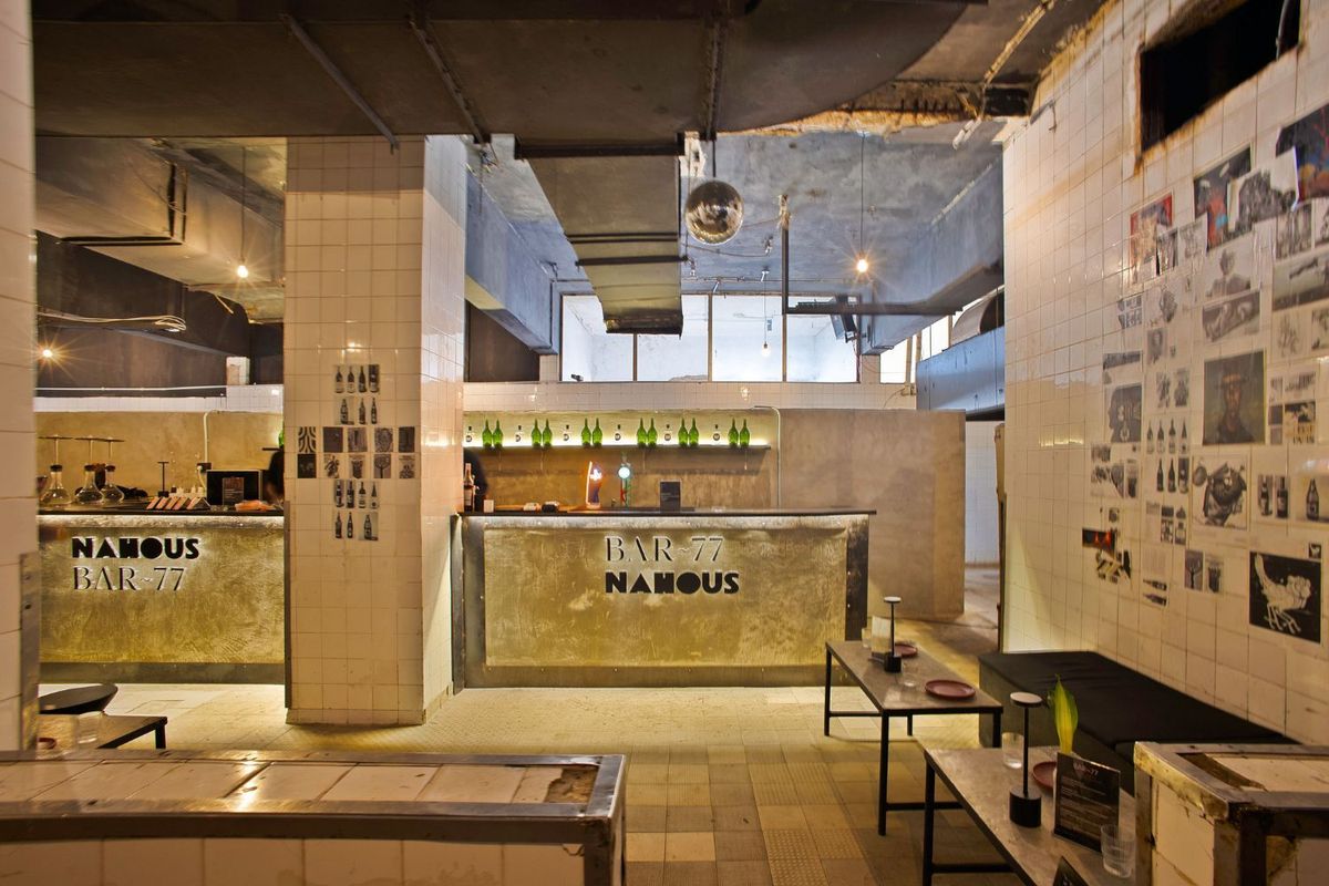 A shot of an open concept bar with a logo that reads “Nahous”