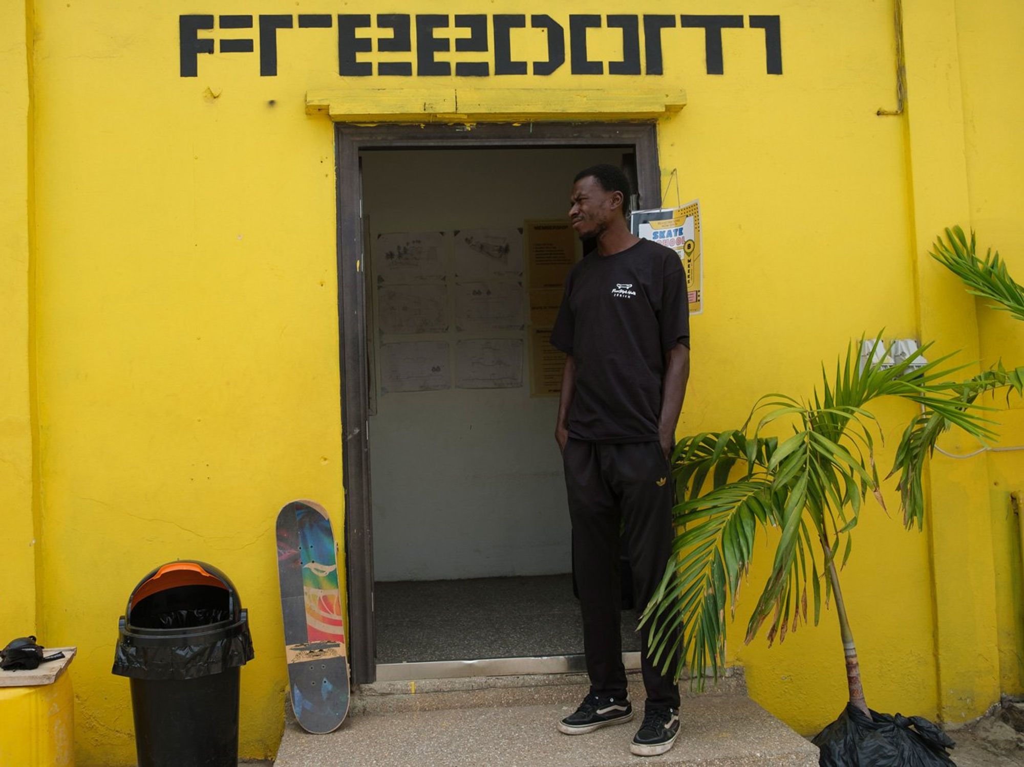 A skateboarder stands at the entrance of a room at the freedom skatepark in Accra