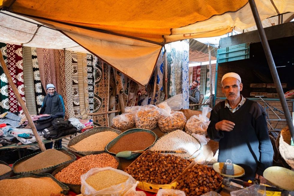 A spice seller in Souk Larbaa in the medina of Casablanca, Morocco.