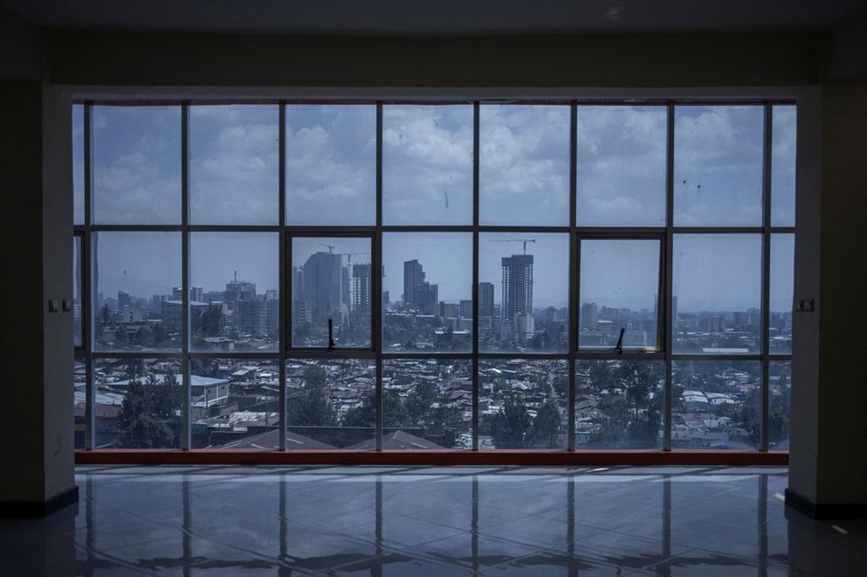 A view of the city's skyline through glass windows.