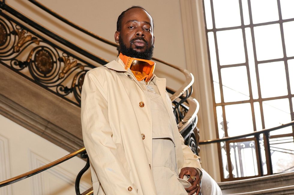 Adekunle Gold attends the Burberry Autumn/Winter 2022 Runway Show, the brand's first live runway for over 2 years, at Central Hall Westminster on March 11, 2022 in London, England. 