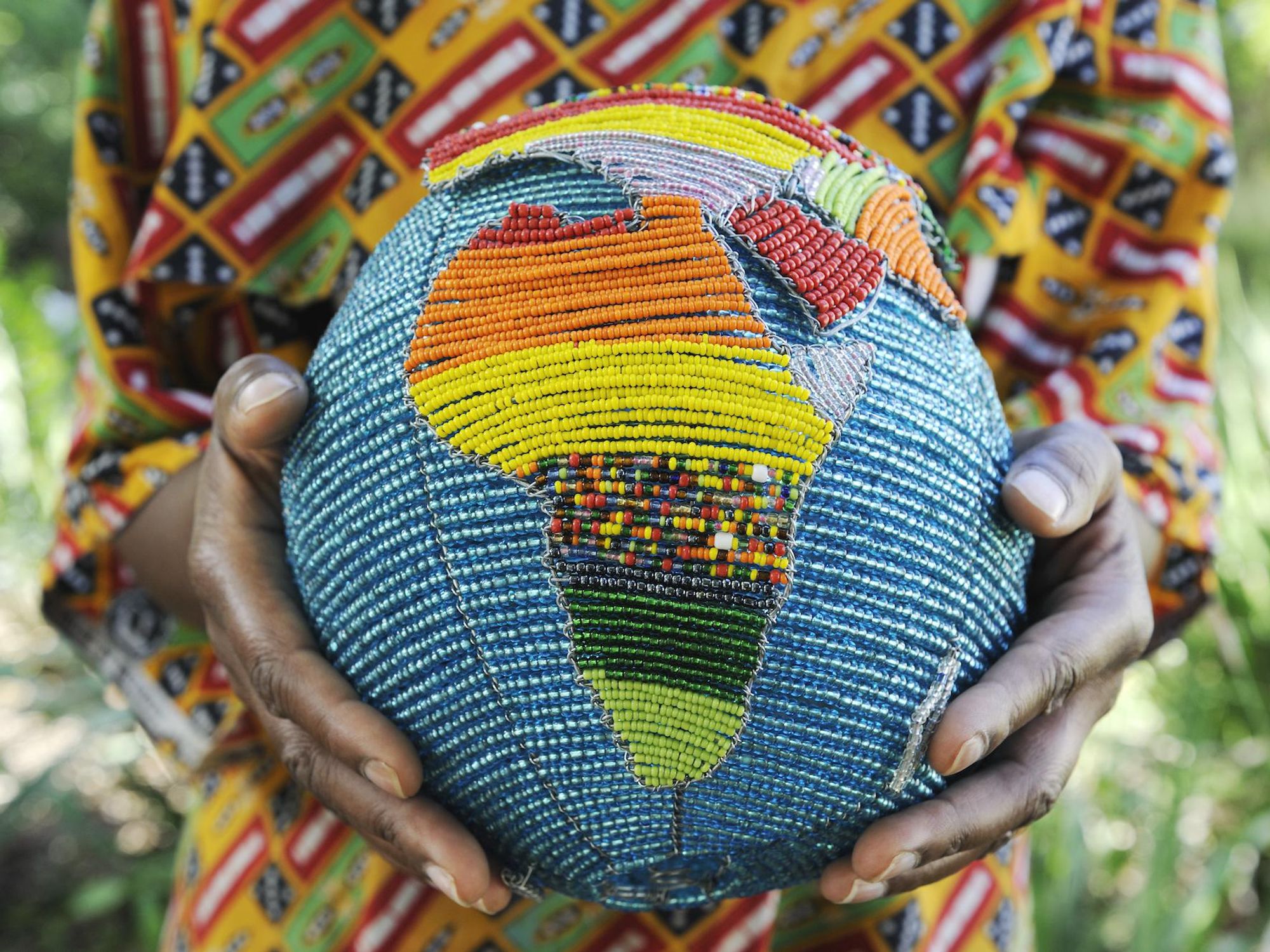 African holding globe