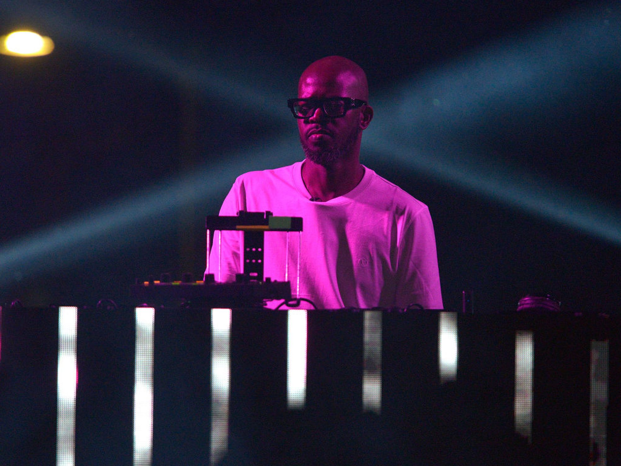 Black Coffee in the deejay booth during a live performance. 
