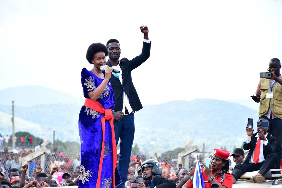 Bobi Wine on top of his vehicle with his wife Barbara ltungo Kyagulanyi as they campaigned in Kasanda district, Central Uganda on November 27, 2020.