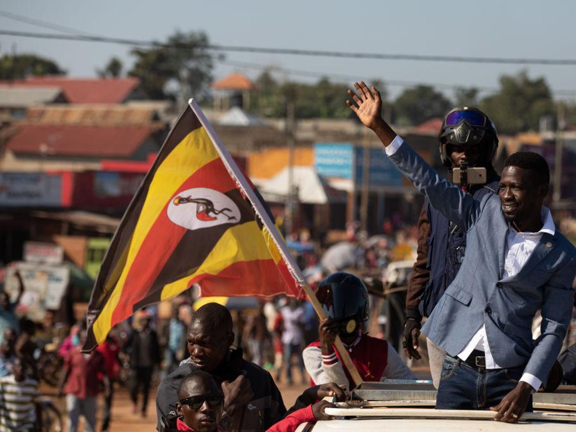 Bobi Wine parades through crowds of people in Kayunga District on December 01, 2020 in Jinja, Uganda. Presidential candidates are campaigning in Uganda ahead of the elections scheduled for the 14 January 2021.