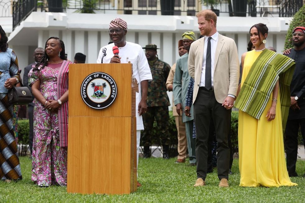 Britain's Prince Harry (2ndR), Duke of Sussex, and Britain's Meghan (R), Duchess of Sussex, react as Lagos State Governor, Babajide Sanwo-Olu (2ndL), gives a speech at the State Governor House in Lagos on May 12, 2024.