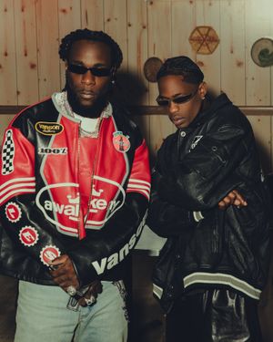 Burna Boy and Travis Scott pose in leather jackets in a new promotional image for their joint single “TaTaTa.”