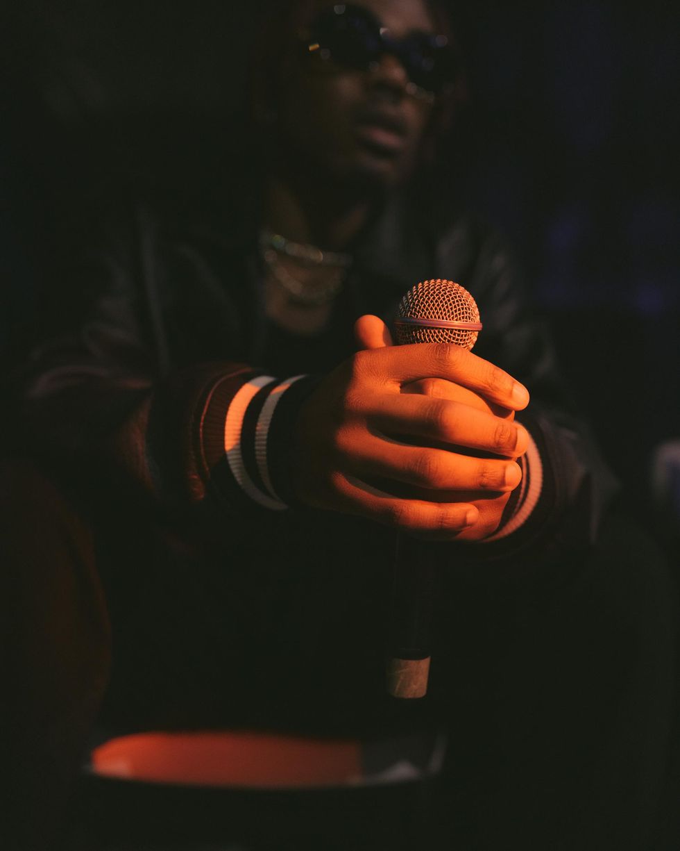 CKay holding a mic