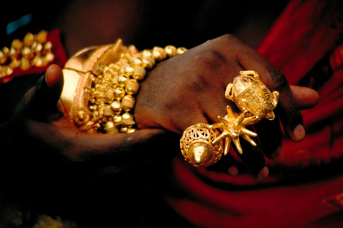 Close up of an Akan king's hand showing traditional Ashanti rings made of pure gold. Such displays of wealth are a common sight at Durbars, traditional gatherings of royalty, throughout Ghana in West Africa.