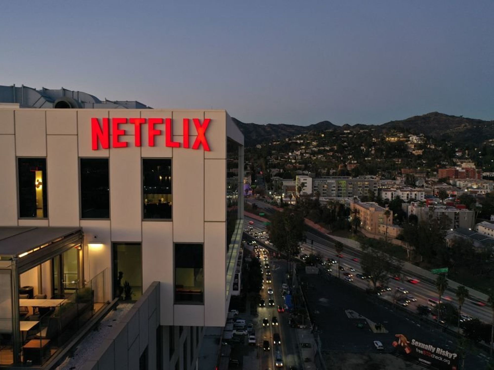 Close up shot of the Netflix logo on top of their office building.