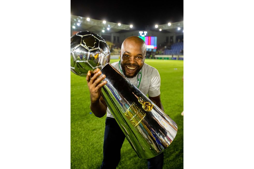 Coach Paul Offor with the Naija Super Eight Trophy on July 16, 2023.