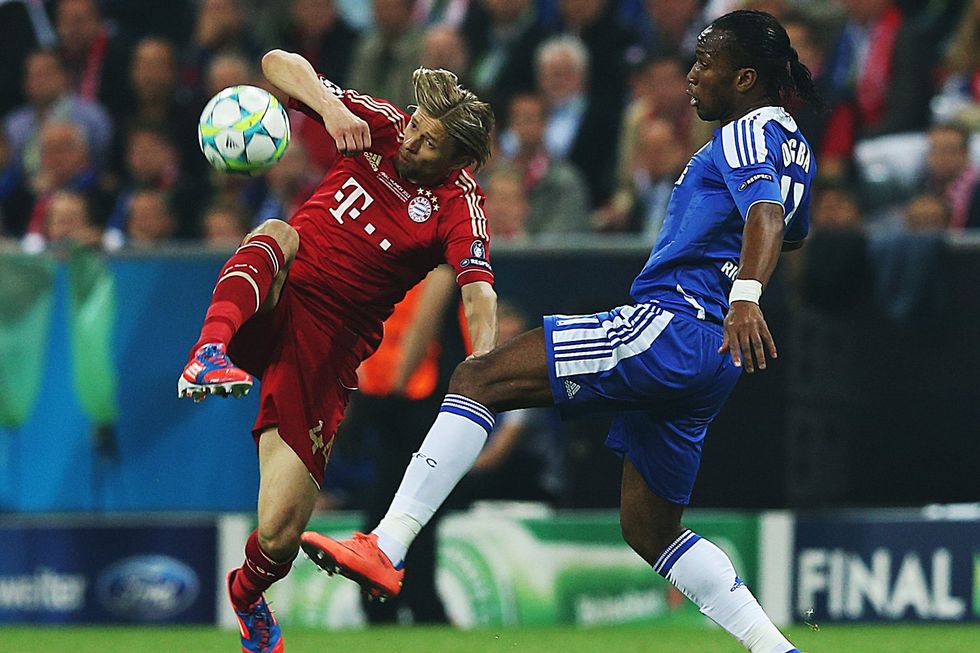 Didier Drogba of Chelsea vies with Anatoliy Tymoshchuk of Bayern Muenchen during UEFA Champions League Final between FC Bayern Muenchen and Chelsea at the Fussball Arena M\u00fcnchen on May 19, 2012 in Munich, Germany.