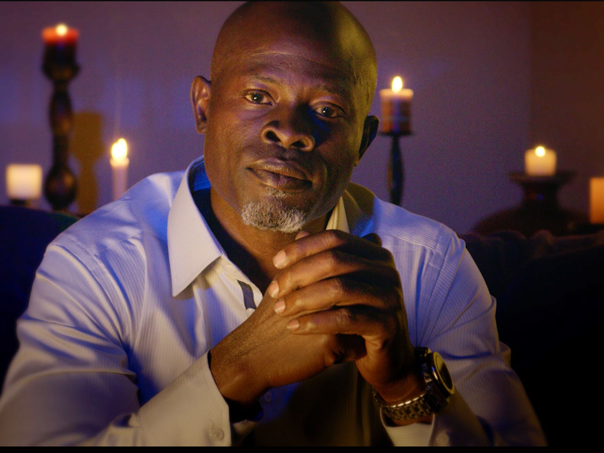 Djimon Honsou looking into camera. Still from in search of voodoo.