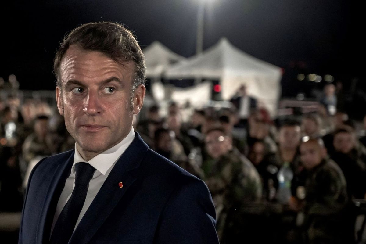France's President Emmanuel Macron looks on during a Christmas dinner at the Air Base 188 "Colonel Massart" in Djibouti, as part of a two-day visit to Djibouti to celebrate Christmas with the French forces deployed in the country, on December 20, 2024.