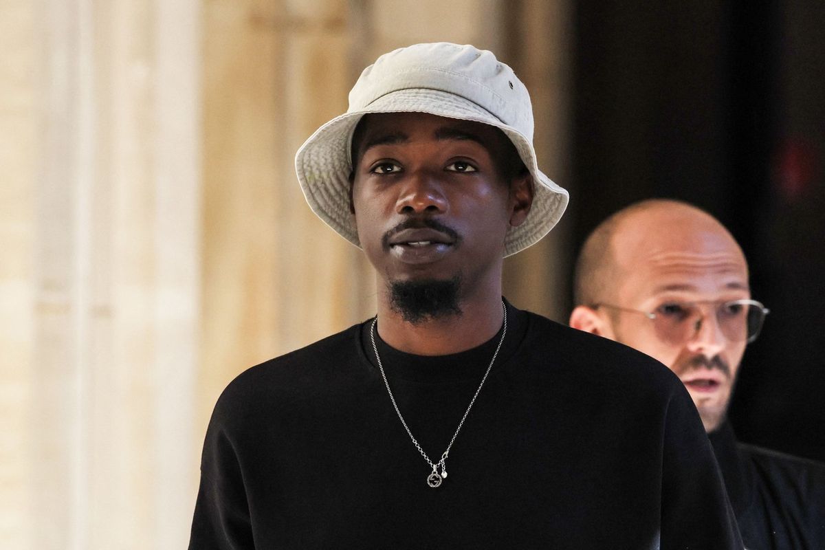 French rapper Mohamed Sylla, aka MHD, arrives for the opening of his and eight other men's trial over a murder committed during a brawl between two rival gangs in Paris in 2018, at the Palais de Justice courthouse in Paris, on September 4, 2023. The artist and four co-defendants will appear free, three others are still in pre-trial detention and the last, still at large, will be tried in absentia. They face thirty years' imprisonment.