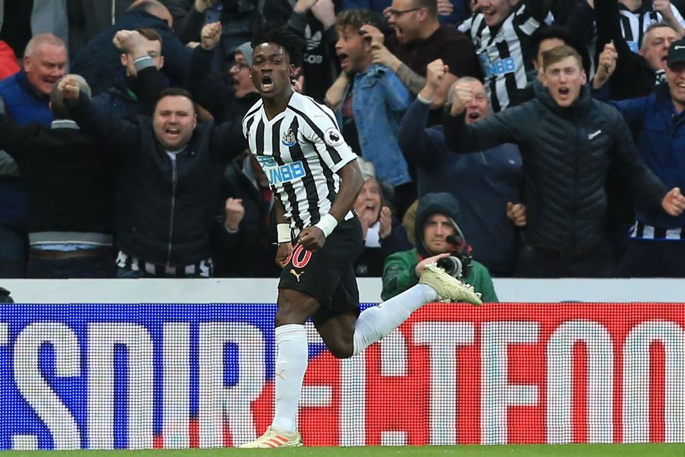 Ghanaian midfielder Christian Atsu celebrates after scoring their first goal during the English Premier League football match between Newcastle United and Liverpool in May, 2019