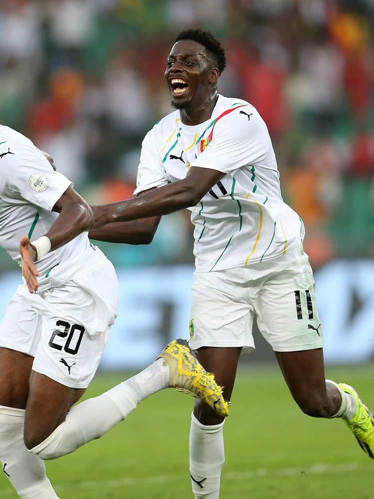 Guinean player Mohamed Bayo (R) is reacting after scoring a goal against Equatorial Guinea during the Round of 16 football match of the Africa Cup of Nations (CAN) 2024 between Guinea and Equatorial Guinea at the Olympic Stadium of Ebimpe in Ivory Coast, on January 28, 2024.