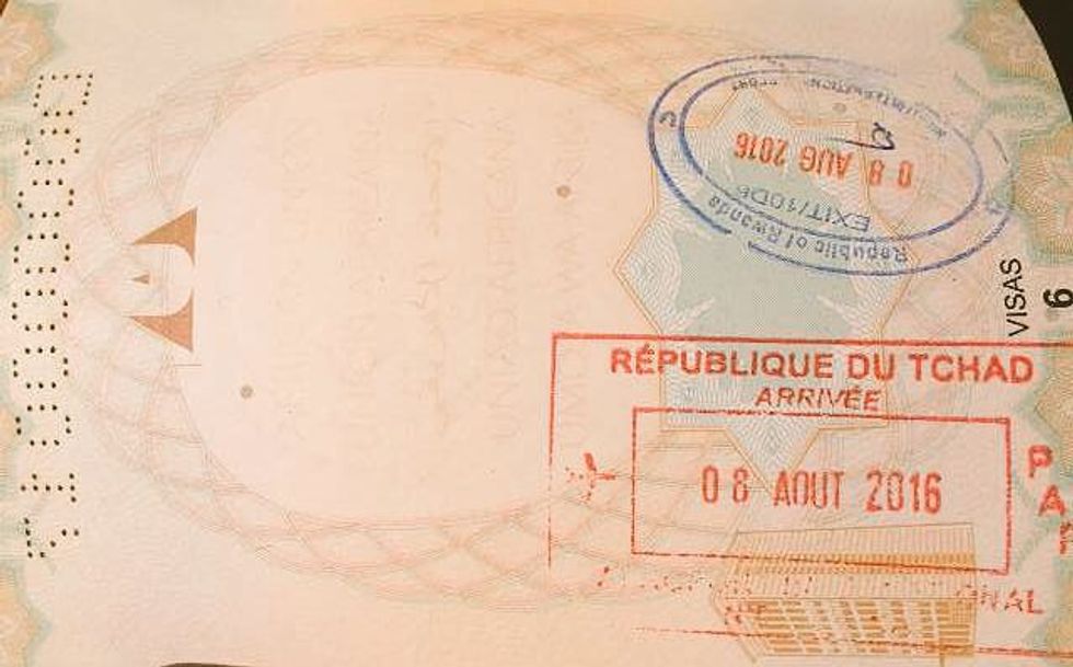 Kagame Shows Off His First African Union E-Passport Stamp
