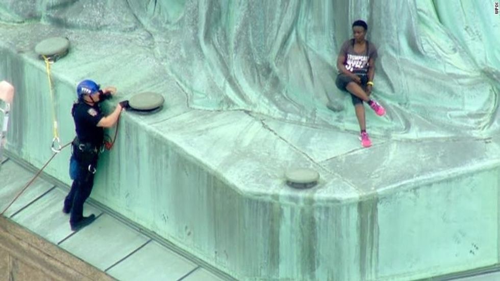 Twitter Salutes Congolese Woman Who Climbed the Statue Of Liberty to Protest Trump's Immigration Policies