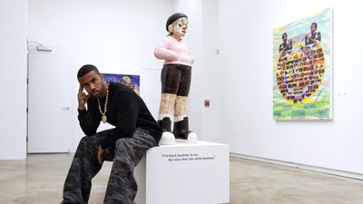 Vic Mensa in front of art