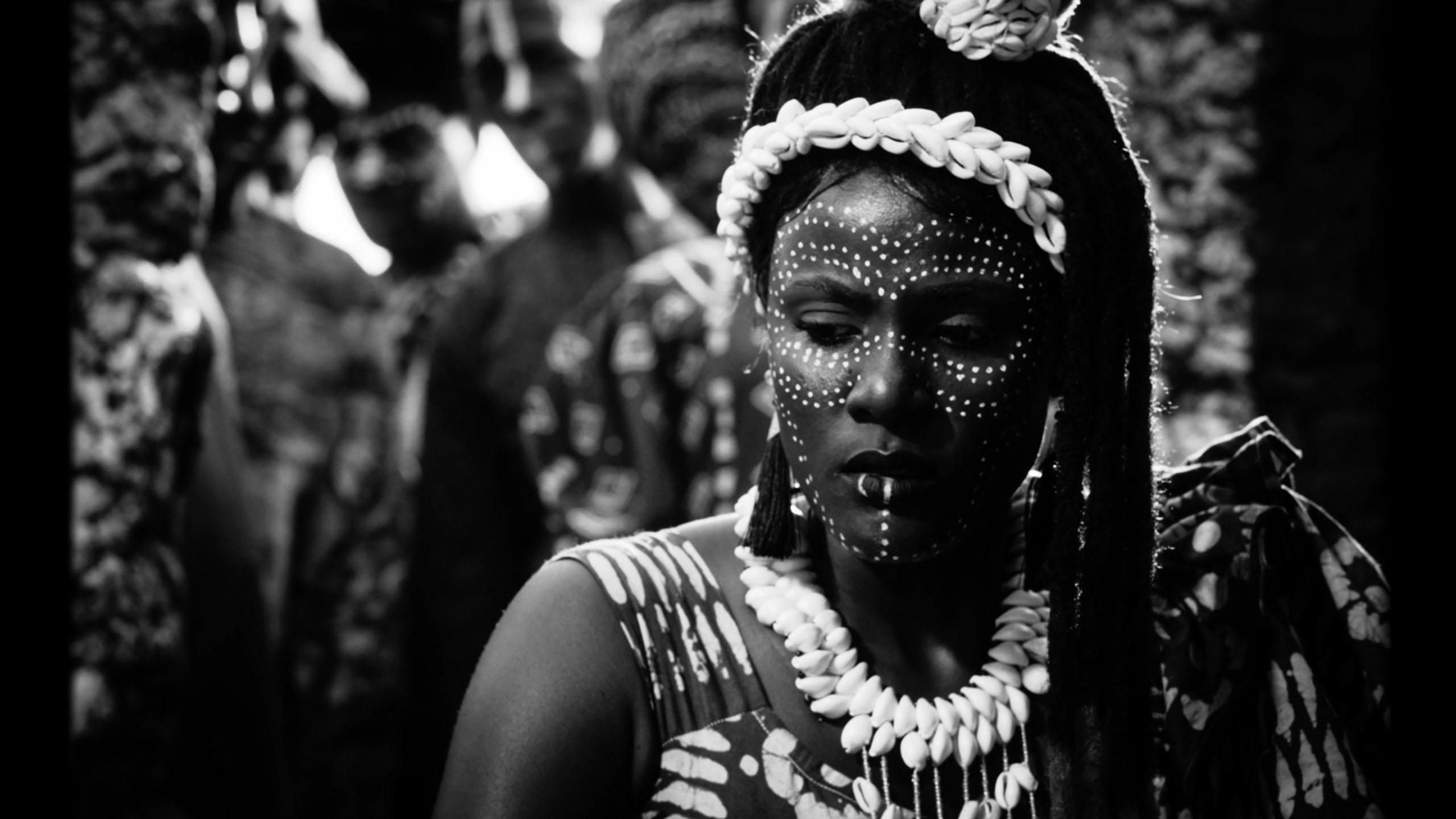 A black and white still from the film of the lead actress Evelyne Ily Juhen.