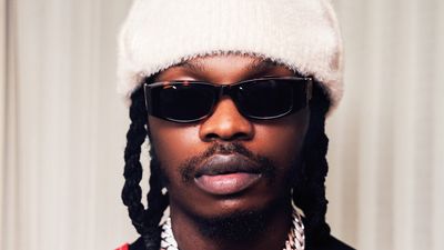 Still shot of Naira Marley with sunglasses and beanie. 