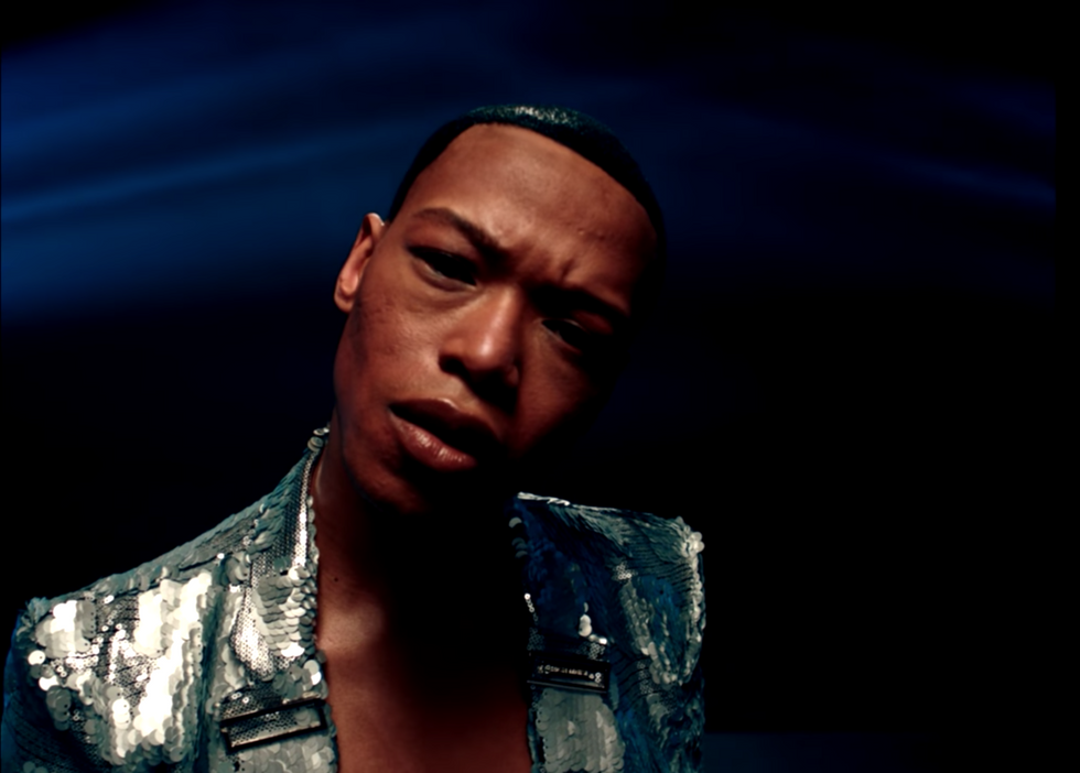 Watch Nakhane Perform in A Shiny Suit in The Music Video For ‘Interloper’