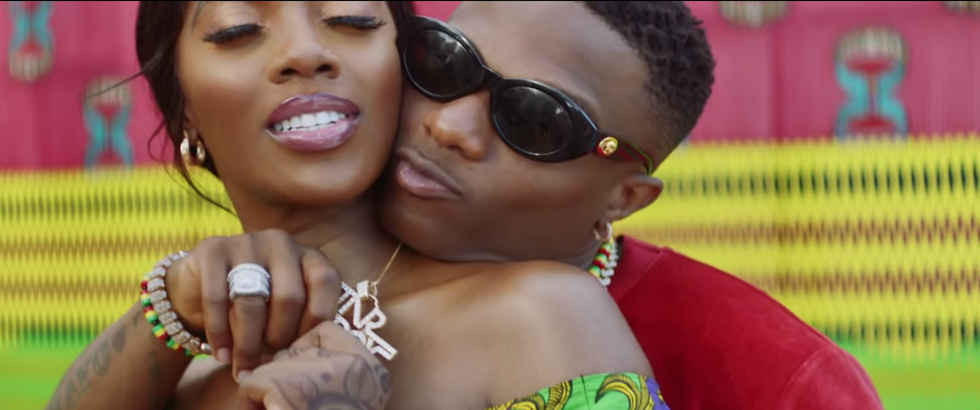 WizKid and Tiwa Savage Get Cozy In The Video For ‘Fever’