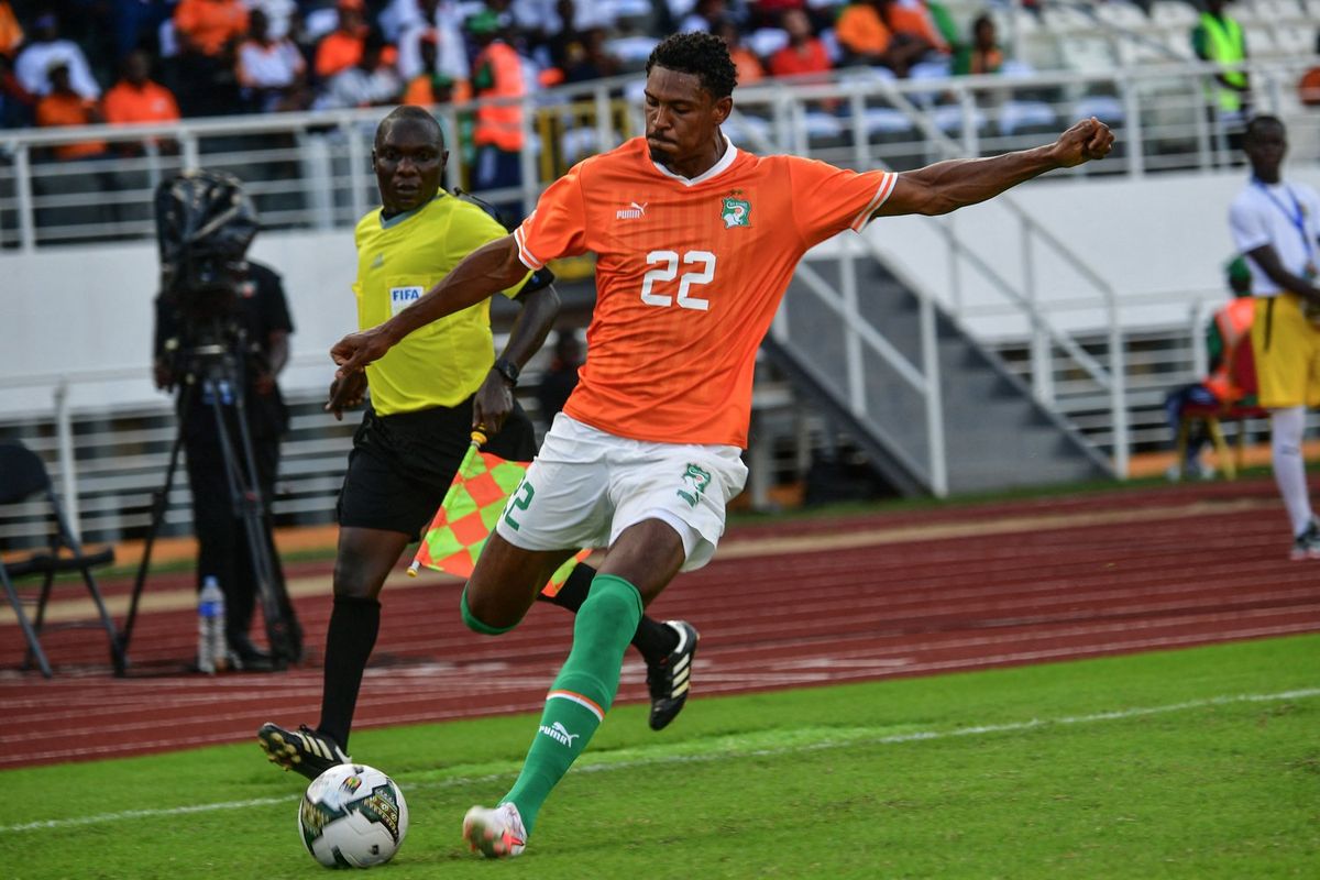 Ivory Coast's #22 Sebatien Romain Teddy Haller kicks the ball during the Africa Cup of Nations qualifying Group H match between Ivory Coast and Lesotho at the Laurent Pokou stadium in San-Pedro on September 9, 2023. 