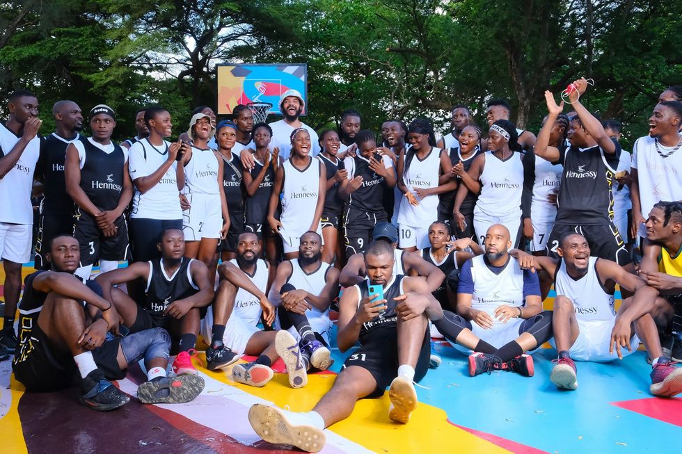 Joakim Noah in a group photo with all the players during the Hennessy 'In The Paint' court unveiling
