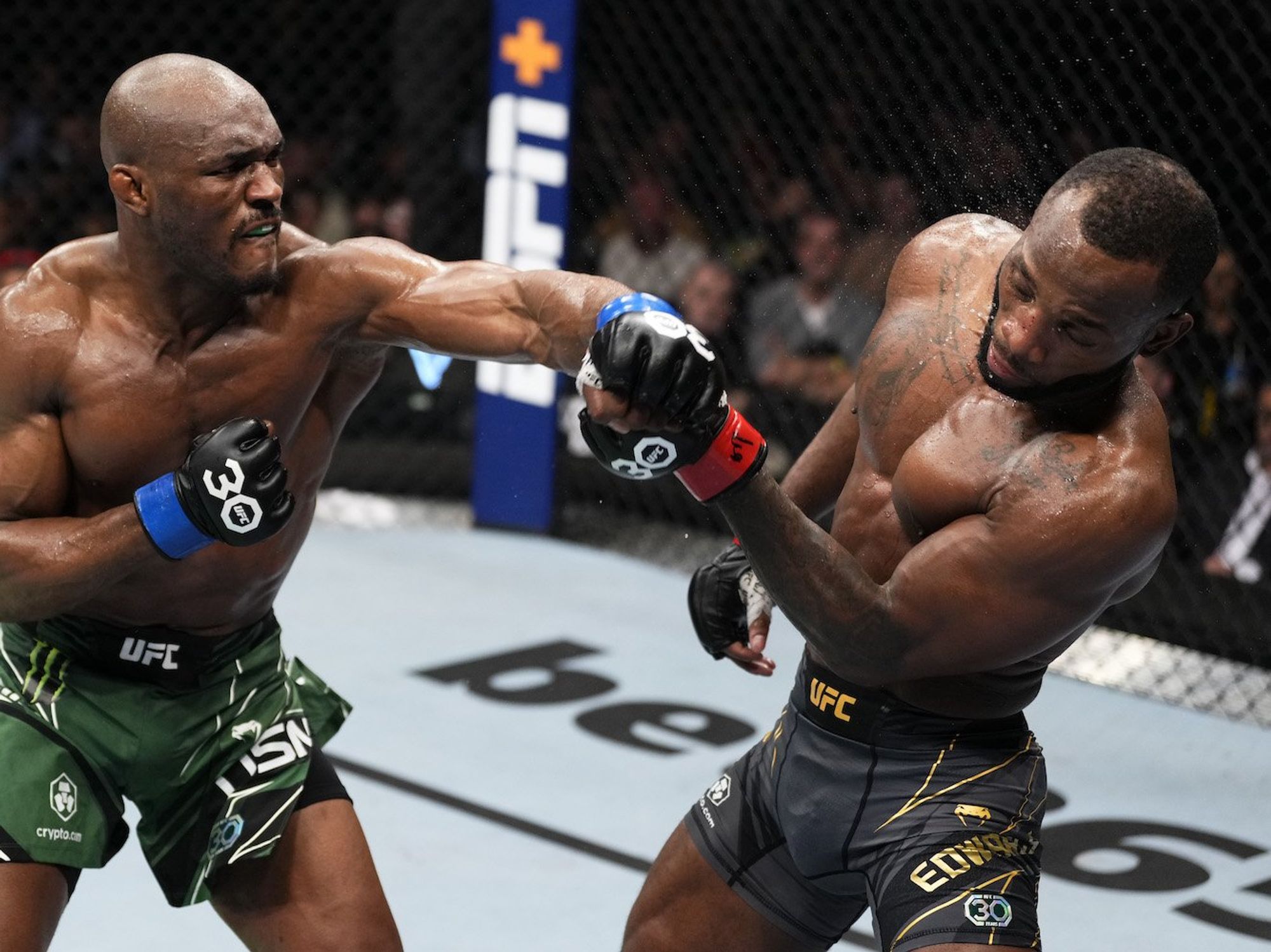 Kamaru Usman punching a fighter