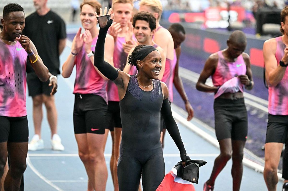 Kenya's Faith Kipyegon (C) reacts at the end of her race after taking part in the "Breaking4" event, in an attempt to become the first woman to run a mile in under four minutes, at Stade Charlety on June 26, 2025 in Paris.