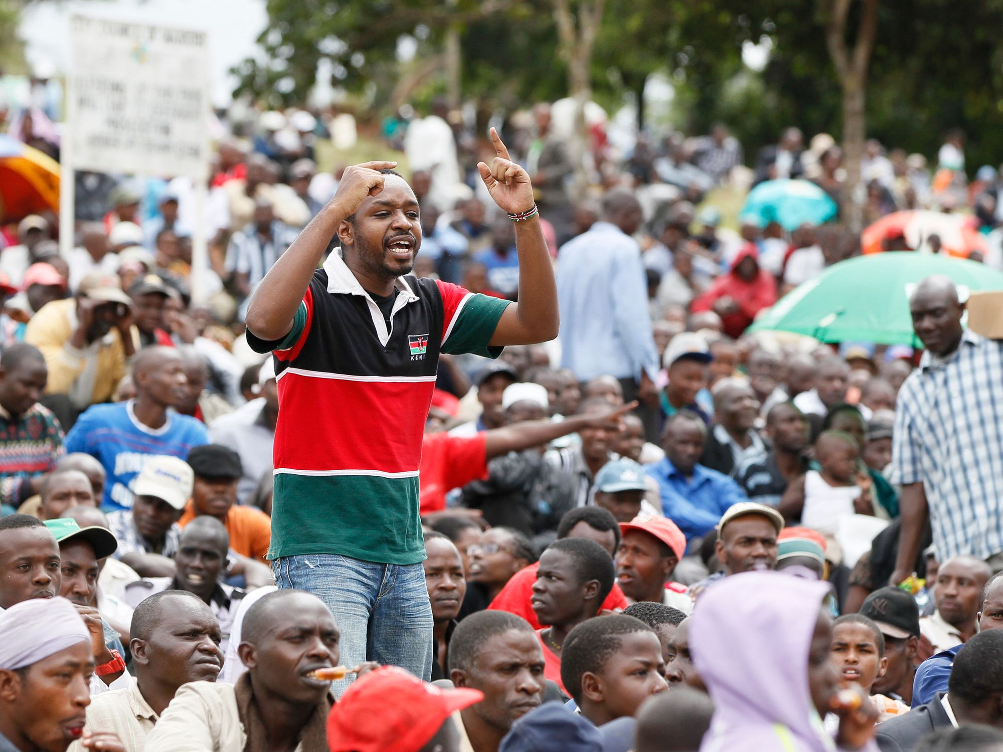 Kenyan anti-corruption protest leader Boniface Mwangi lecturing a crowd in a scene from Softie.