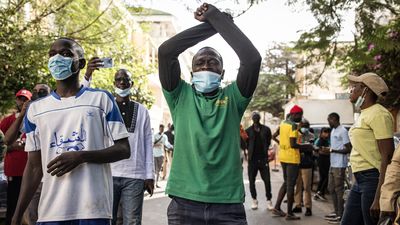 A Protester gestures at the police outside the General Assembly in Plateau, Dakar on February 5, 2024.